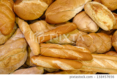 Various types of white wheat bread - loaves, baguettes, buns, rolls 138457656