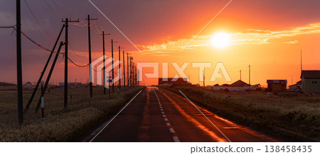 A poignant scene of the Notsuke-Furen Park Line on the Notsuke Peninsula in Hokkaido at dusk as the sun sets. A poignant scene of the Notsuke-Furen Park Line on the Notsuke Peninsula in Hokkaido at dusk as the sun sets. 138458435