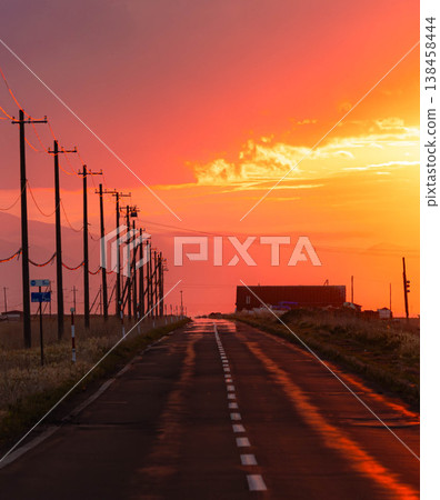 A poignant scene of the Notsuke-Furen Park Line on the Notsuke Peninsula in Hokkaido at dusk as the sun sets. A poignant scene of the Notsuke-Furen Park Line on the Notsuke Peninsula in Hokkaido at dusk as the sun sets. 138458444