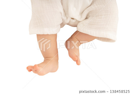 Tiny baby feet are gently dangling in the air, isolated, PNG Tiny baby feet are gently dangling in the air, isolated, PNG 138458525