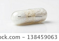 Nad nmn resveratrol combo capsule supplement powder granule nutrient vitamin bottle Macro view of transparent capsule with white powder granule labeled nad nmn resveratrol combo clean background 138459063