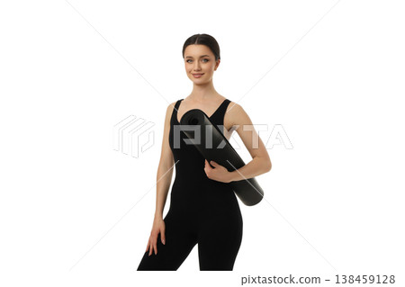 Yoga woman holds a black mat while standing in studio, PNG Yoga woman holds a black mat while standing in studio, PNG 138459128