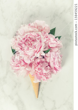 Pink Peony Bouquet in Ice Cream Cone on Marble Surface Pink Peony Bouquet in Ice Cream Cone on Marble Surface 138459221