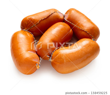 Appetizing sausages close-up on a white isolated background Appetizing sausages close-up on a white isolated background 138459225