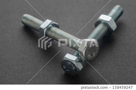 construction bolts close-up on a black background construction bolts close-up on a black background 138459247