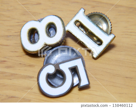 Badges that indicate grade and class are attached to middle school and high school student uniforms. Badges that indicate grade and class are attached to middle school and high school student uniforms. 138460112