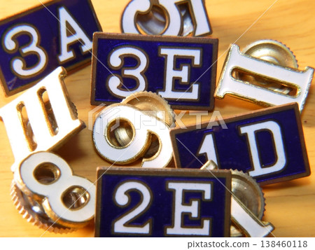 Badges that indicate grade and class are attached to middle school and high school student uniforms. Badges that indicate grade and class are attached to middle school and high school student uniforms. 138460118