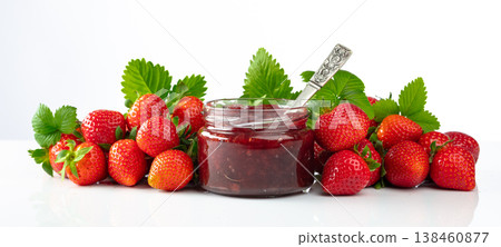 Strawberry jam and fresh berries are isolated on a white background. 138460877