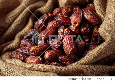 Dates in burlap bag. Dates in burlap bag. 138460984