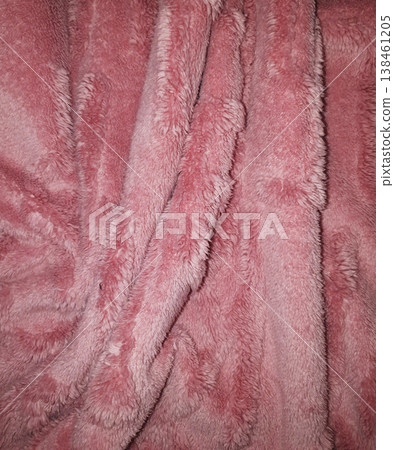 Close-up of soft pink faux fur fabric texture with waves and shadows. Minimalist abstract background for fashion, cozy lifestyle, winter comfort, and feminine design. Close-up of soft pink faux fur fabric texture with waves and shadows. Minimalist abstract background for fashion, cozy lifestyle, winter comfort, and feminine design. 138461205