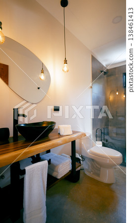 Modern bathroom with stone vessel sink and wooden vanity Modern bathroom with stone vessel sink and wooden vanity 138461413