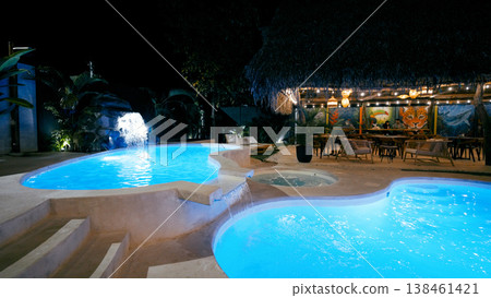 Resort swimming pool and bar area at night 138461421
