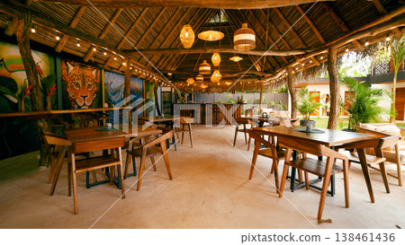 Tropical open air restaurant with a thatched roof Tropical open air restaurant with a thatched roof 138461436