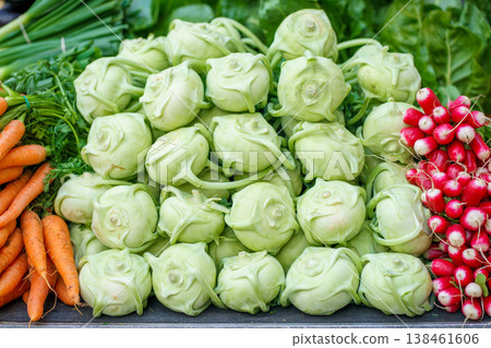 Pile of kohlrabi Brassica oleracea Gongylodes, carrots Nantes and radish Cherry Belle at market stall, fresh organic vegetables, healthy food concept Pile of kohlrabi Brassica oleracea Gongylodes, carrots Nantes and radish Cherry Belle at market stall, fresh organic vegetables, healthy food concept 138461606