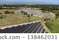 Aerial view of solar panels connected to electricity substation 138462031