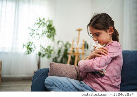 Little girl feeling sad hugging stuffed animal Little girl feeling sad hugging stuffed animal 138462854