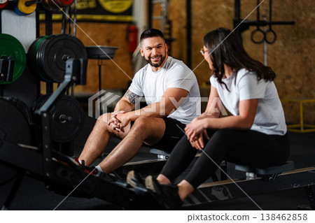 Couple resting and talking together after gym workout 138462858