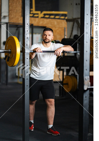 Active man in sportswear resting at the gym Active man in sportswear resting at the gym 138462859
