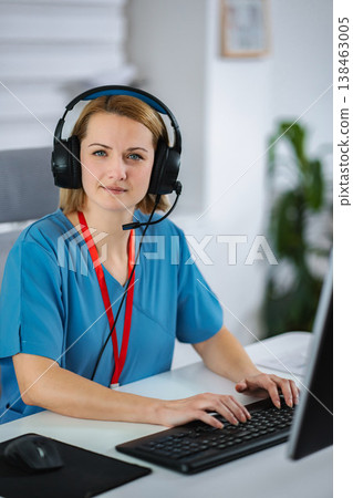 Female healthcare worker providing online medical assistance Female healthcare worker providing online medical assistance 138463005