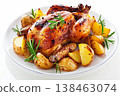 roasted chicken and potatoes on white plate isolated on a white background. 138463074