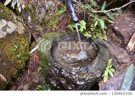 Spring water flowing along the Higashiyama walking trail in Takayama City, Gifu Prefecture, Japan. Spring water flowing along the Higashiyama walking trail in Takayama City, Gifu Prefecture, Japan. 138463108