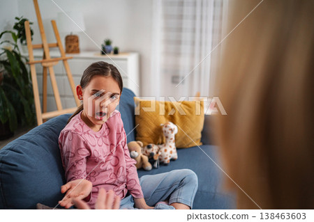 Young girl talking during child psychology session Young girl talking during child psychology session 138463603