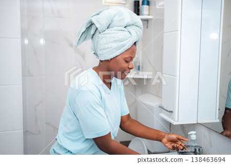 Woman washing hands as part of daily hygiene routine Woman washing hands as part of daily hygiene routine 138463694