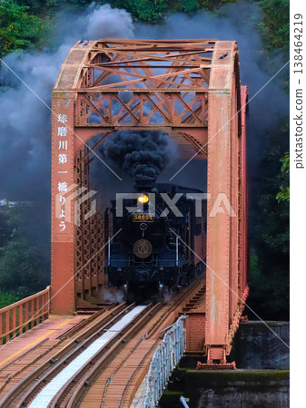 Steam locomotive across the iron bridge Steam locomotive across the iron bridge 138464219
