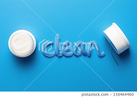 Sparkling clean results achieved with vibrant blue thread art and pristine white spool on azure background Sparkling clean results achieved with vibrant blue thread art and pristine white spool on azure background 138464460