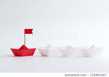 Red paper boat leads a fleet of white vessels, symbolizing leadership and a clear direction on a light background. Red paper boat leads a fleet of white vessels, symbolizing leadership and a clear direction on a light background. 138465267