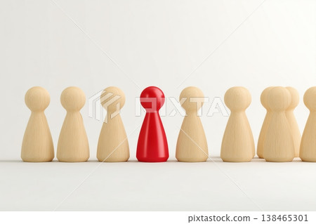 Standing out from the crowd with a red figure among wooden figures, symbolizing leadership and uniqueness. Standing out from the crowd with a red figure among wooden figures, symbolizing leadership and uniqueness. 138465301