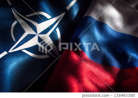 Flags of NATO and Russia converge in a symbolic representation of geopolitical tension and alliance conflict Flags of NATO and Russia converge in a symbolic representation of geopolitical tension and alliance conflict 138465380