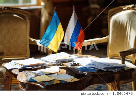 Negotiation table with Ukrainian and Russian flags, symbolizing diplomatic talks and potential conflict resolution Negotiation table with Ukrainian and Russian flags, symbolizing diplomatic talks and potential conflict resolution 138465476