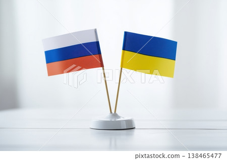 Ukraine and Russia flags are together on a table, representing international relations and political negotiations for peace Ukraine and Russia flags are together on a table, representing international relations and political negotiations for peace 138465477