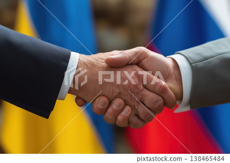 Business handshake demonstrates agreement and partnership with Ukraine and Russia flags symbolizing international accord. Business handshake demonstrates agreement and partnership with Ukraine and Russia flags symbolizing international accord. 138465484
