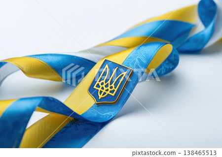 Ukraine ribbon featuring its national colors, blue and yellow, with the Ukrainian coat of arms, the Tryzub, prominently displayed. 138465513