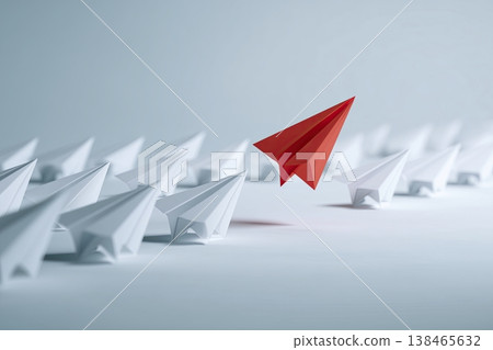 One red paper airplane soars above many white ones, symbolizing leadership, innovation and a new creative direction. One red paper airplane soars above many white ones, symbolizing leadership, innovation and a new creative direction. 138465632