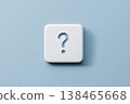 Question mark sign on a white cube against a blue background showcases problem solving and unanswered queries. 138465668