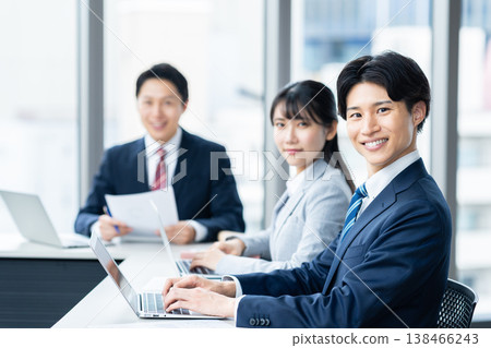 Businessmen holding a meeting in an office. Filming assistance provided by: Denpa Gakuen Educational Foundation, Tokyo Electronics College. Businessmen holding a meeting in an office. Filming assistance provided by: Denpa Gakuen Educational Foundation, Tokyo Electronics College. 138466243
