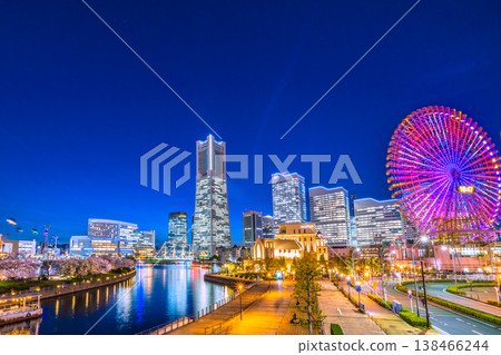 Yokohama cityscape, Japan, April 3rd. View of Yokohama Landmark Tower, ropeway, houseboats, and cherry blossoms along the Kishamichi promenade. Yokohama cityscape, Japan, April 3rd. View of Yokohama Landmark Tower, ropeway, houseboats, and cherry blossoms along the Kishamichi promenade. 138466244