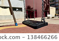 Empty black and gris swing on sandy playground for children, no people 138466266