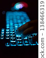 Working on a neon computer keyboard with colored backlighting. Selected focus. Computer video games, hacking, technology, internet concept. Selected focus. 138466319