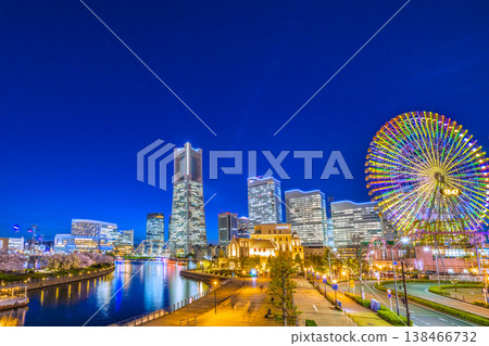 Yokohama cityscape, Japan, April 3rd. View of Yokohama Landmark Tower, ropeway, houseboats, and cherry blossoms along the Kishamichi promenade. Yokohama cityscape, Japan, April 3rd. View of Yokohama Landmark Tower, ropeway, houseboats, and cherry blossoms along the Kishamichi promenade. 138466732