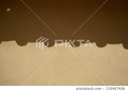 The shadow of the tiled roof cast on the earthen wall The shadow of the tiled roof cast on the earthen wall 138467486