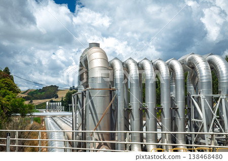 Industrial geothermal pipelines under dramatic clouds 138468480