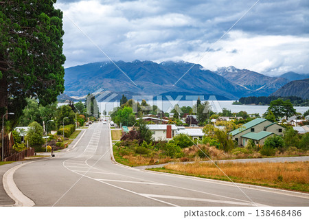 Wanaka neighborhood road with lake and mountains Wanaka neighborhood road with lake and mountains 138468486