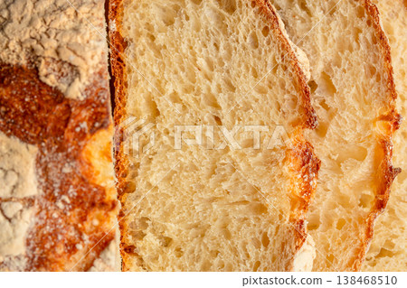 Closeup of artisan sourdough bread slices showing airy crumb texture 138468510