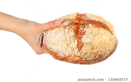Female hand holding artisan sourdough bread loaf isolated on light background Female hand holding artisan sourdough bread loaf isolated on light background 138468537