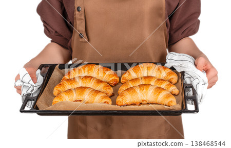 Baker holding tray with fresh croissants Baker holding tray with fresh croissants 138468544