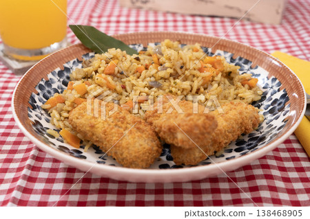 Spiced Rice with Golden Fried Fish Strips Spiced Rice with Golden Fried Fish Strips 138468905